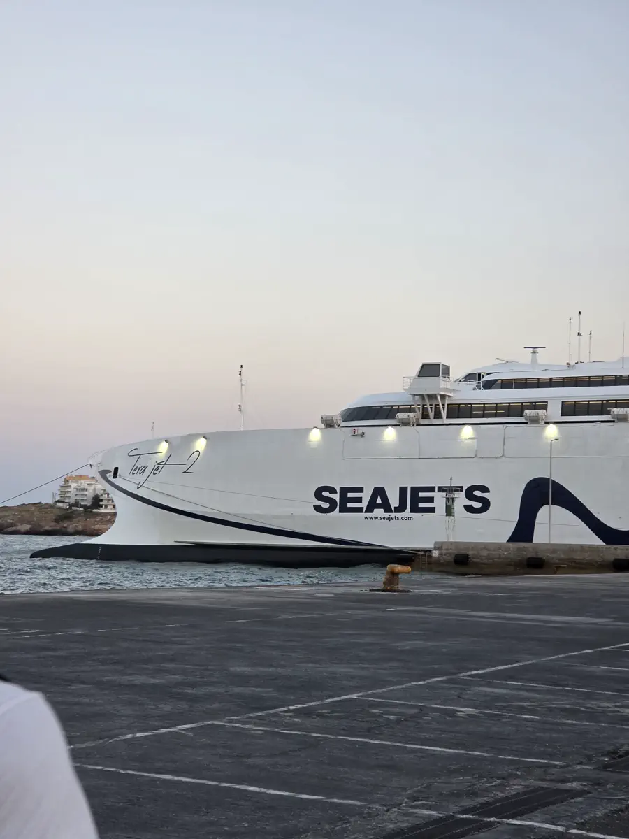 A Seajets ferry moored alongside the quay at dusk